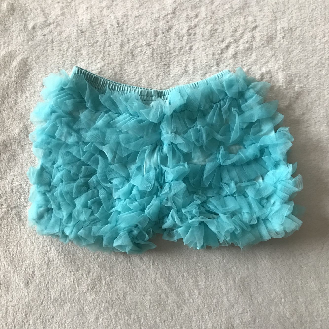 G5-8-6;. Green and blue yarn shorts