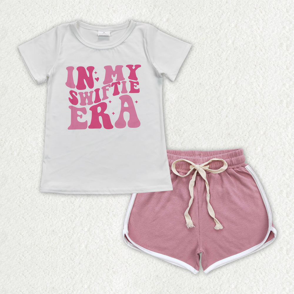 GT0437+SS0293 in my swiftie era white short sleeve top with letters dark pink shorts