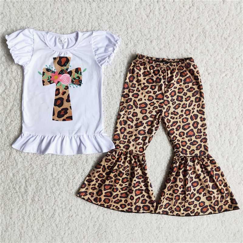 cross white top with  Leopard print pants